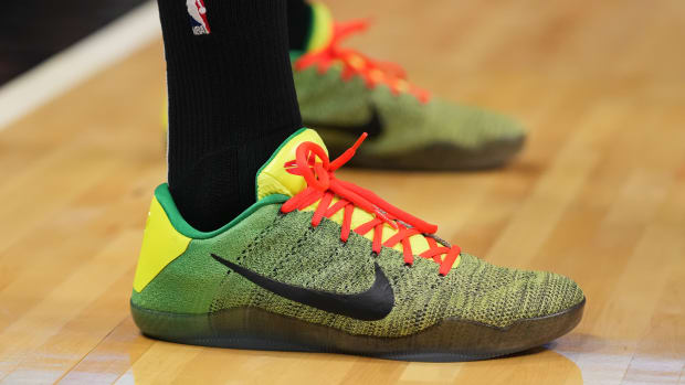 Miami Heat forward P.J. Tucker's green and red Nike Kobe sneakers.