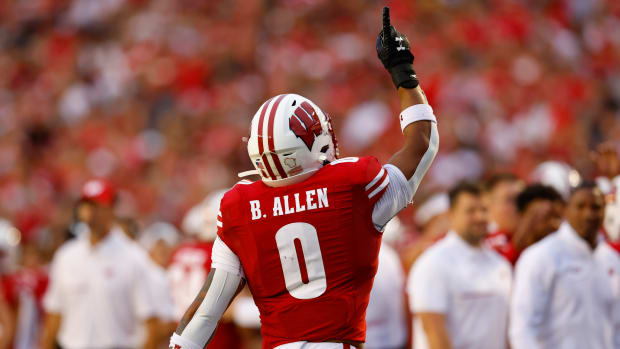 Wisconsin running back Braelon Allen pointing to the sky to honor former running backs coach Gary Brown.