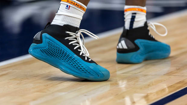 Minnesota Timberwolves guard Anthony Edwards' blue and black adidas shoes.