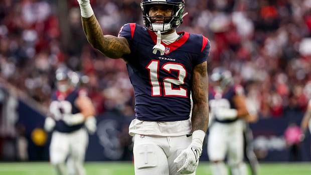 Texans wide receiver Nico Collins (12) celebrates catching the ball during the first quarter in a 2024 AFC wild card game at NRG Stadium.