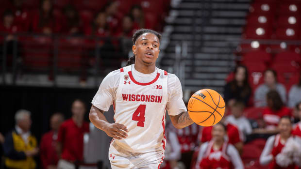 Wisconsin guard Kamari McGee bringing the ball up the court for the Badgers during a scrimmage.