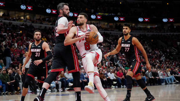 Miami Heat forward Kevin Love defends Chicago Bulls guard Zach LaVine.