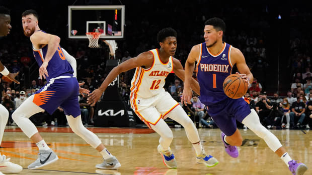 Phoenix Suns guard Devin Booker (1) drives to the basket against the Atlanta Hawks in the first half at Footprint Center.