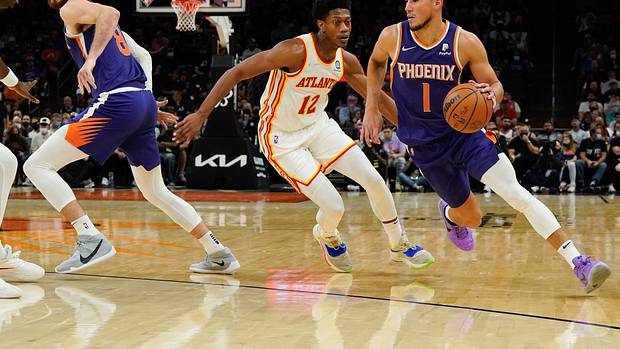 Phoenix Suns guard Devin Booker (1) drives to the basket against the Atlanta Hawks in the first half at Footprint Center.