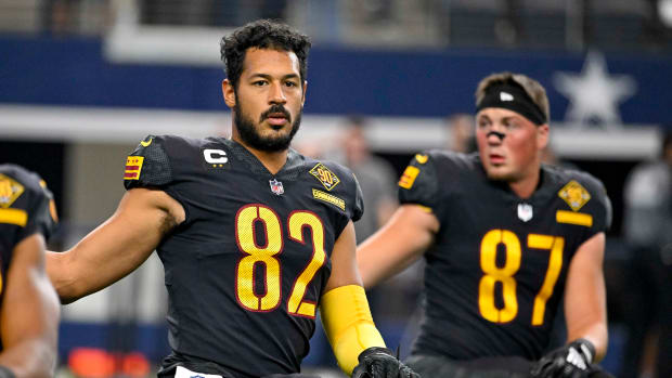 Washington Commanders tight ends Logan Thomas (82) and John Bates (87) prepare for a game against the Dallas Cowboys.