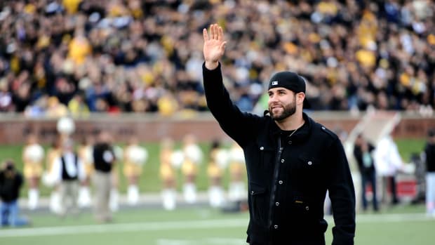 Missouri Tigers and New Orleans Saints quarterback Chase Daniel waves to fans during the first half against the Texas Tech Red Raiders at Faurot Field.