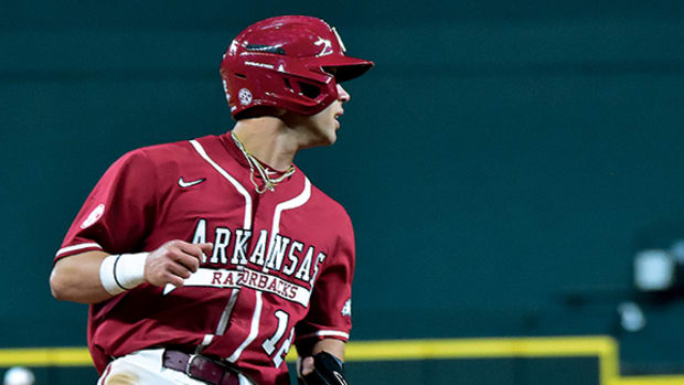Arkansas outfielder Tavian Josenberger rounds third against Texas in the late innings of the College Baseball Showdown.
