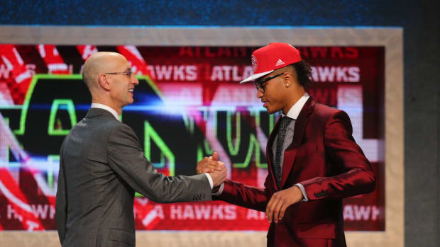 Kelly Oubre (Kansas) greets NBA commissioner Adam Silver after being selected as the number fifteen overall pick to the Atlanta Hawks in the first round of the 2015 NBA Draft at Barclays Center.