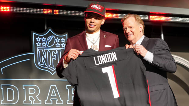 Apr 28, 2022; Las Vegas, NV, USA; USC wide receiver Drake London with NFL commissioner Roger Goodell after being selected as the eighth overall pick to the Atlanta Falcons during the first round of the 2022 NFL Draft at the NFL Draft Theater.