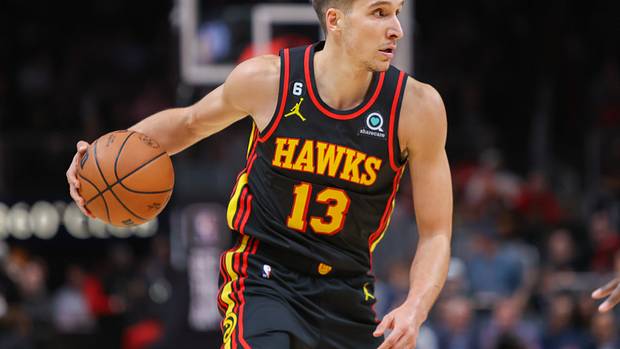 Hawks guard Bogdan Bogdanovic dribbles the ball.