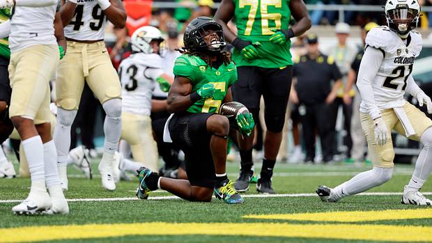 Oregon Ducks running back Noah Whittington celebrates after scoring a touchdown against the Colorado Buffaloes.