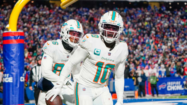 Miami Dolphins wide receiver Tyreek Hill (10) reacts to scoring a touchdown against the Buffalo Bills during the second half at Highmark Stadium.