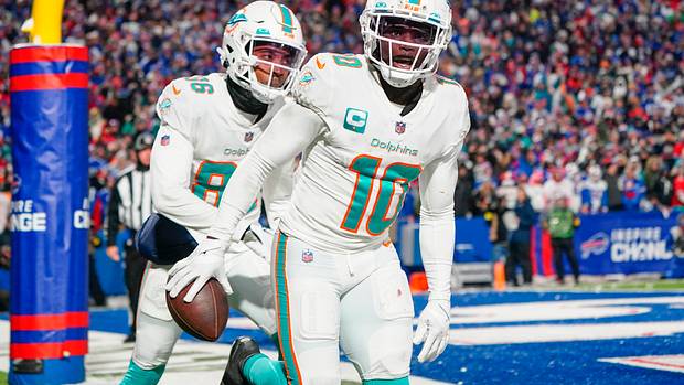 Miami Dolphins wide receiver Tyreek Hill (10) reacts to scoring a touchdown against the Buffalo Bills during the second half at Highmark Stadium.