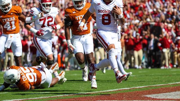 Oklahoma Sooners QB Dillon Gabriel runs for a touchdown against the Texas Longhorns.