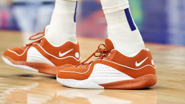 Phoenix Suns forward Kevin Durant's orange and white Nike sneakers.