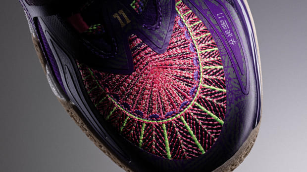 The forefoot of Kyrie Irving's purple and red ANTA shoe.