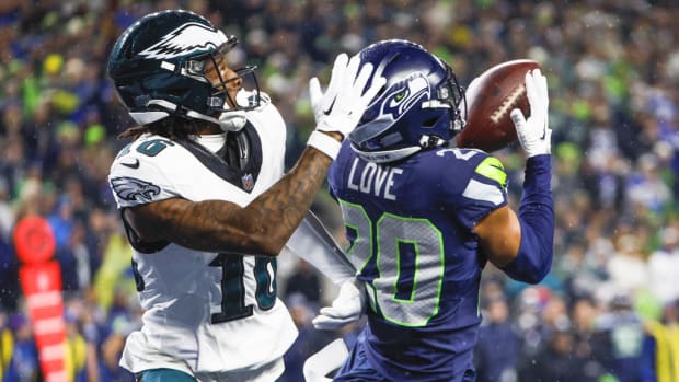Seattle Seahawks safety Julian Love (20) intercepts a pass intended for Philadelphia Eagles wide receiver Quez Watkins (16) during the fourth quarter at Lumen Field. Joe Nicholson-USA TODAY Sports 