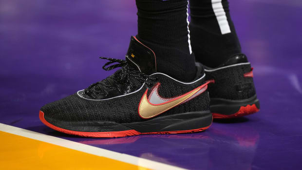 View of LeBron James' black and red Nike shoes.