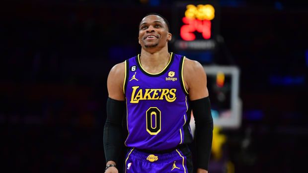 Lakers guard Russell Westbrook smile during a timeout.