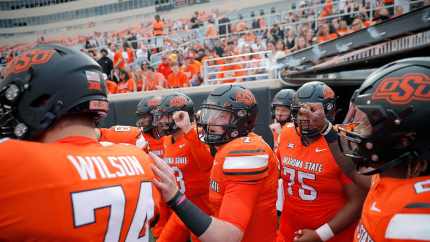 Sep 16, 2023; Stillwater, Oklahoma, USA; Oklahoma State Cowboys quarterback Alan Bowman (7) takes the field to warm up before an NCAA football game between Oklahoma State and South Alabama at Boone Pickens Stadium. Mandatory Credit: Bryan Terry-USA TODAY Sports