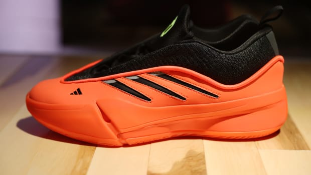 Side view of Damian Lillard's red and black adidas sneaker.