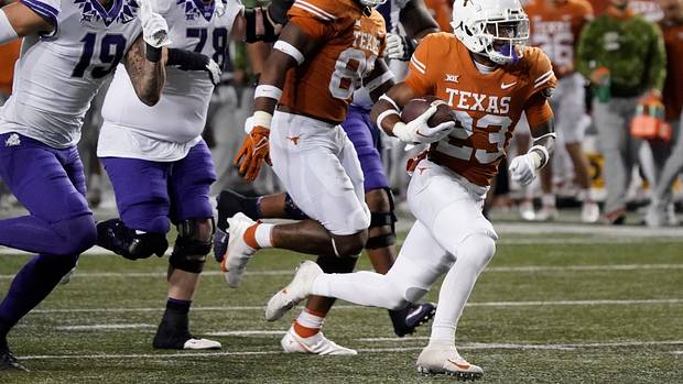 Texas Longhorns defensive back Jahdae Barron (23) runs for a touchdown after recovering a fumble against the Texas Christian Horned Frogs during the second half at Darrell K Royal-Texas Memorial Stadium