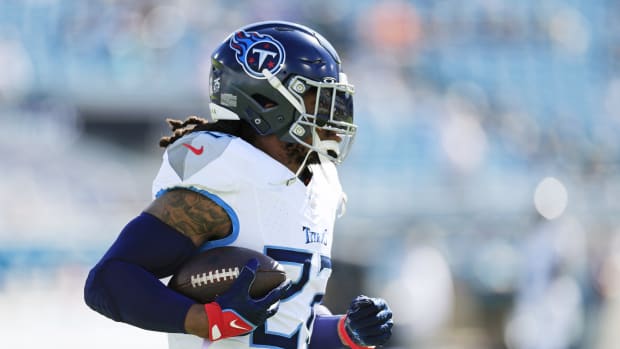 Tennessee Titans running back Derrick Henry carries the football.