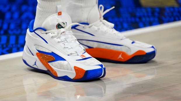 Dallas Mavericks guard Luka Doncic's white, blue, and orange Jordan Brand sneakers.