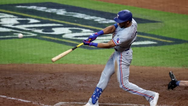 Oct 16, 2023; Houston, Texas, USA; Texas Rangers center fielder Leody Taveras (3) hits a triple in the sixth inning against the Houston Astros during game two of the ALCS for the 2023 MLB playoffs at Minute Maid Park. Mandatory Credit: Troy Taormina-USA TODAY Sports  