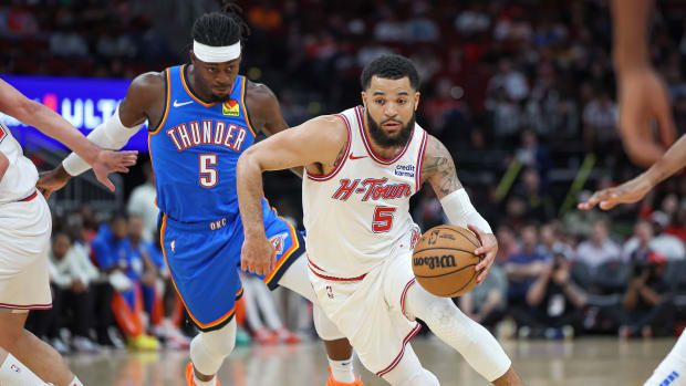 Houston Rockets guard Fred VanVleet (5) drives with the ball as Oklahoma City Thunder guard Luguentz Dort (5) defends during the first quarter at Toyota Center.