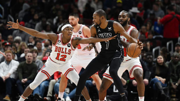 Brooklyn Nets forward Kevin Durant is defended in the first half by Chicago Bulls guard Ayo Dosunmu and Patrick Williams
