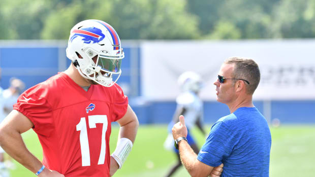 Jul 28, 2021; Orchard Park, NY, United States; Buffalo Bills general manager Brandon Beane has a word with quarterback Josh Allen (17) after practice at the Buffalo Bills Training Facility. Mandatory Credit: Mark Konezny-USA TODAY Sports