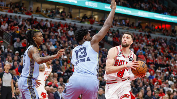 Apr 2, 2023; Chicago, Illinois, USA; Chicago Bulls guard Zach LaVine (8) drives to the basket against Memphis Grizzlies forward Jaren Jackson Jr. (13)