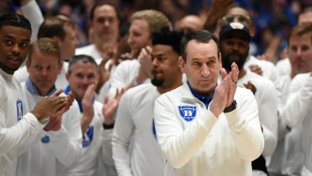 Mar 5, 2022; Durham, North Carolina, USA; Duke Blue Devils head coach Mike Krzyzewski (center) gestures to the crowd as they cheer prior to a game against the North Carolina Tar Heels at Cameron Indoor Stadium.