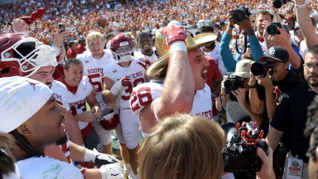 Oklahoma Sooners linebacker Danny Stutsman (28) celebrates with the Golden Hat Trophy after the Red River Rivalry college football game between the University of Oklahoma Sooners (OU) and the University it Texas Longhorns