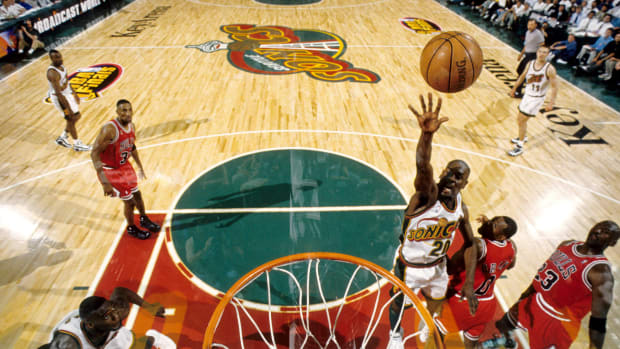 Seattle Supersonics guard Gary Payton lays the ball up against the Chicago Bulls during the 1996 NBA Finals at Key Arena