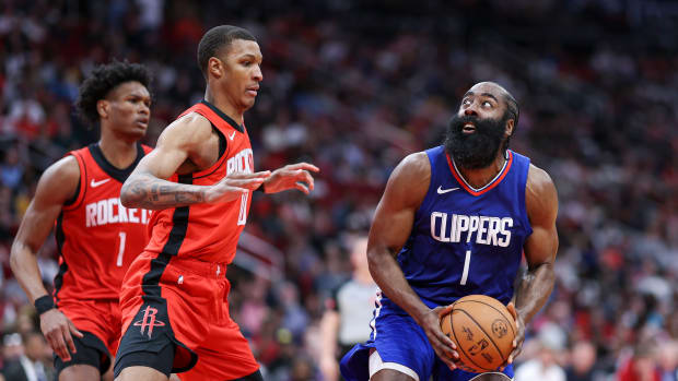 Angeles Clippers guard James Harden (1) controls the ball as Houston Rockets forward Jabari Smith Jr. (10) defends during the fourth quarter at Toyota Center.