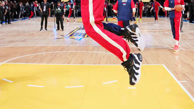 LeBron James dunks during warms up before the 2024 NBA All-Star game.