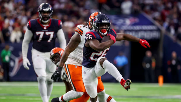 Texans running back Devin Singletary (26) runs with the ball during the second quarter in a 2024 AFC wild card game at NRG Stadium.