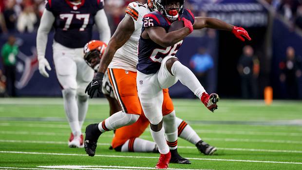 Texans running back Devin Singletary (26) runs with the ball during the second quarter in a 2024 AFC wild card game at NRG Stadium.
