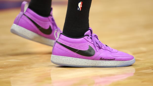 Phoenix Suns guard Devin Booker's purple and black Nike sneakers.