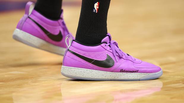 Phoenix Suns guard Devin Booker's purple and black Nike sneakers.