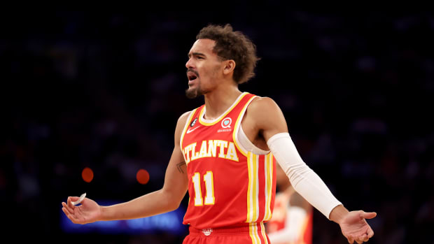 Hawks guard Trae Young questions a foul call.