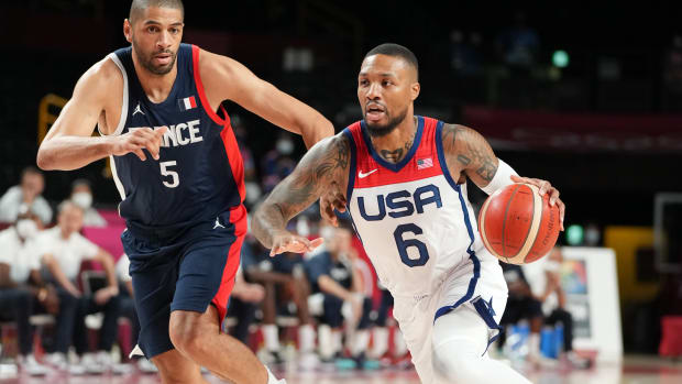 Team USA guard Damian Lillard dribbles past a defender during the 2020 Olympic Summer Games.