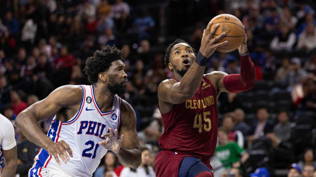 Cleveland Cavaliers guard Donovan Mitchell (45) drives for a shot against Philadelphia 76ers center Joel Embiid (21) during the second quarter at Wells Fargo Center.
