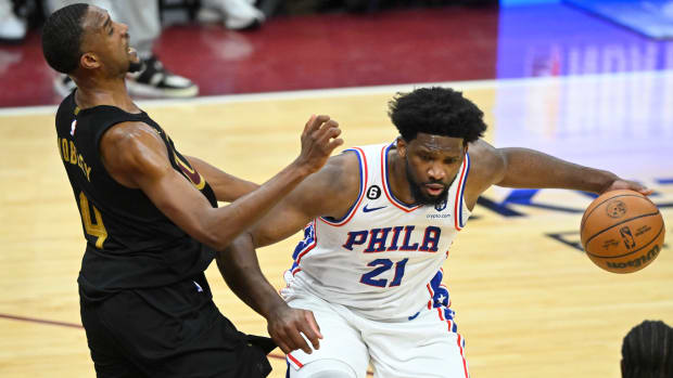 Mar 15, 2023; Cleveland, Ohio, USA; Philadelphia 76ers center Joel Embiid (21) collides with Cleveland Cavaliers forward Evan Mobley (4) in the fourth quarter at Rocket Mortgage FieldHouse. Mandatory Credit: David Richard-USA TODAY