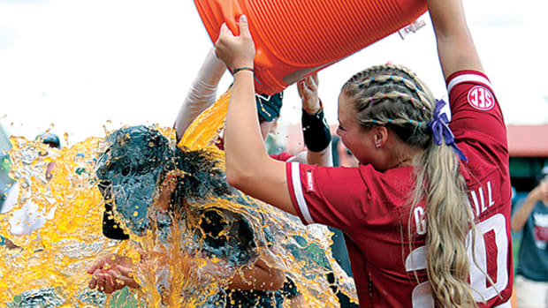 Arkansas Razorback softball coach Courtney Deifel gets bathed in Gatorade during her postgame interview with ESPN following the team's 4-0 shutout of Missouri in the SEC tournament championship game at Florida. It was the Razorbacks' first appearance in the championship this century and the team's first ever tournament title.