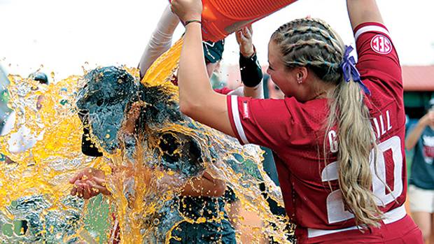 Arkansas Razorback softball coach Courtney Deifel gets bathed in Gatorade during her postgame interview with ESPN following the team's 4-0 shutout of Missouri in the SEC tournament championship game at Florida. It was the Razorbacks' first appearance in the championship this century and the team's first ever tournament title.