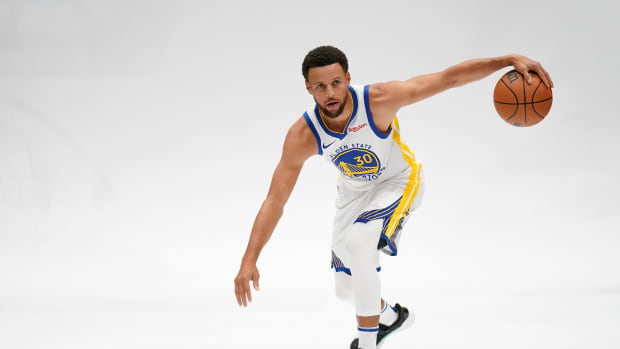 Golden State Warriors guard Stephen Curry dribbles the ball during Media Day.