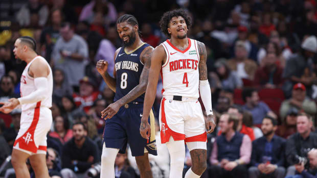 Rockets guard Jalen Green (4) and New Orleans Pelicans forward Naji Marshall (8) react after a play during the fourth quarter at Toyota Center.